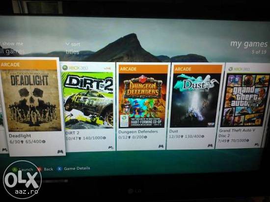Vând x-box360+2 manete+50jocuri