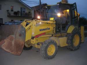 Buldoexcavator KOMATSU de vanzare