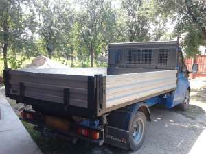 EXECUT TRANSPORT BASCULABIL LA PRETURI DE CRIZA