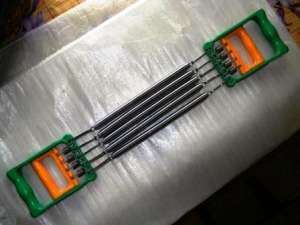 Extensor cu arcuri metalice si manere duble,                                   ramburs